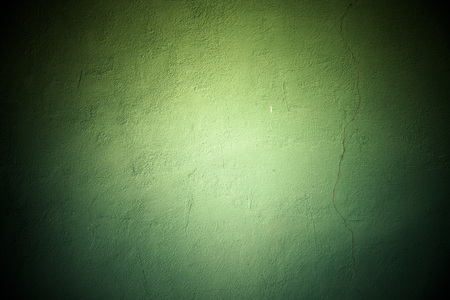 Plastered wall with a vertical crack. Background. Toned.の写真素材