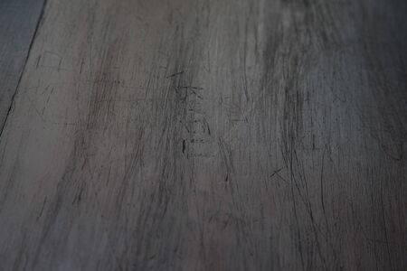 Texture of old wooden scratched desk. Background.の写真素材