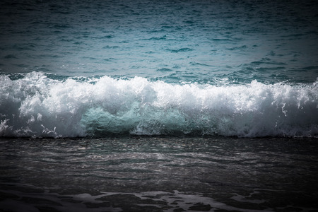 Crystal water on beach near Paphos. Mediterranean coast. Cyprus. Toned.の写真素材