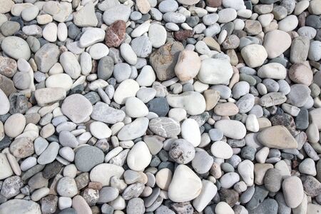 Different stones pebble beach.