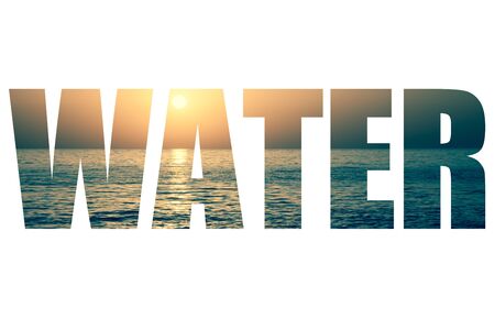 Word WATER over the sun setting over the horizon.の写真素材