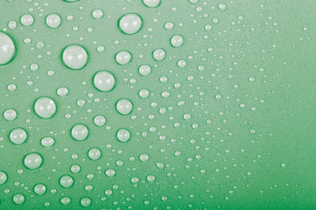 Drops of water on a color background. Green. Shallow depth of field. Selective focus.の写真素材