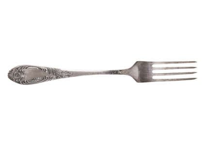 Old metal fork isolated on a white background.の写真素材
