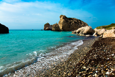 Pebble beach and blue sea in the Aphrodites birthplace. Paphos, Cyprus. Toned.の写真素材