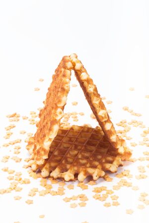 Wafer and pastry decoration stars on a light background. Selective focus.の写真素材