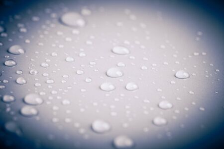 Drops of water on a color background. Toned gray. Shallow depth of field. background