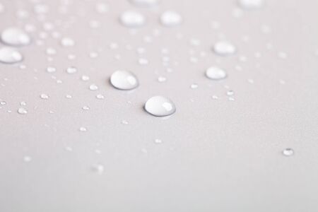 Drops of water on a color background. Toned gray. Shallow depth of field. backgroundの写真素材