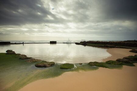 View of the embankment in the evening before the storm. Estoril, Lisbon, Portugal. Dramatic view.の写真素材