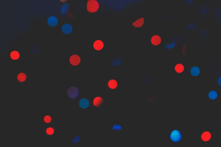 Defocused abstract red and blue christmas background. Toned.の写真素材
