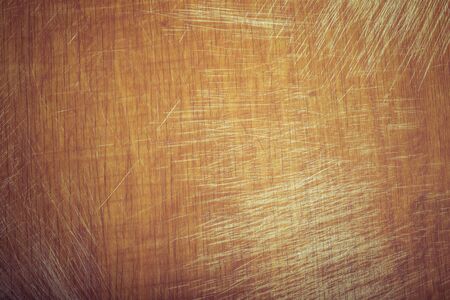 Old worn out cutting board with flour and dough residues. Background texture. Toned.