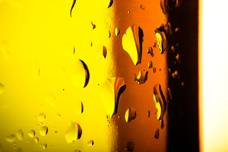 Water droplets on colored glass. Abstract background texture. Very shallow depth of field. Selective...