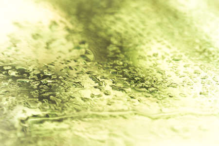 Drops of water on a color background. Shallow depth of field. Selective focus. Toned.の写真素材