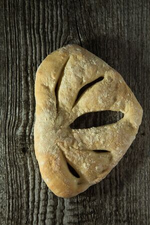 Fresh homemade bread on light grey table.