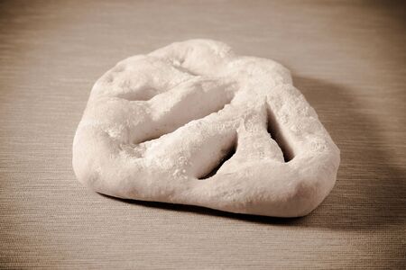 Fresh homemade bread on light grey table. Selective focus.