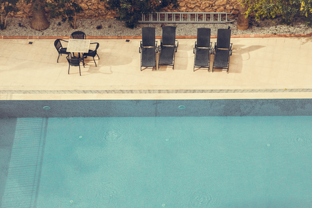 Blue water in a hotels swimming pool. Toned.の写真素材