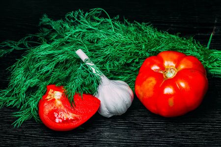 Fresh ripe vegetables on a black table or board like background. Toned.の写真素材