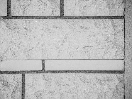 Fragment of decorative stone texture wall or fence for natural material background. Closeup detail....