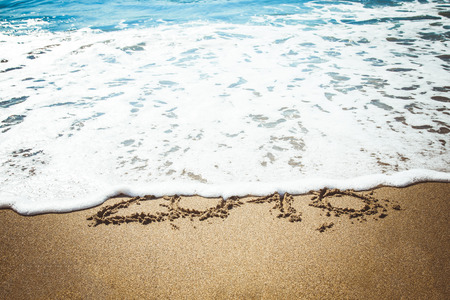 Figures 2016 sea wave with foam washes sand on the beach in Alanya Turkey. Toned.の写真素材