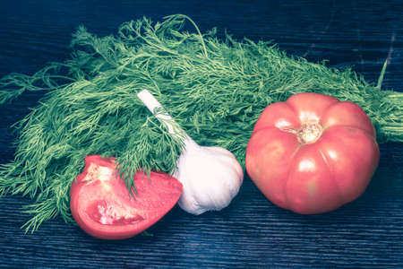 Fresh ripe vegetables on a black table or board like background. Toned.の写真素材