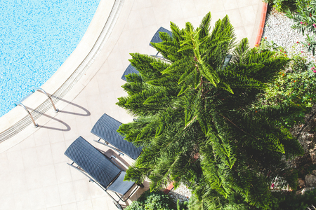 Fragment of hotel territory in Alanya Turkey. Blue water in a swimming pool. Toned.の写真素材