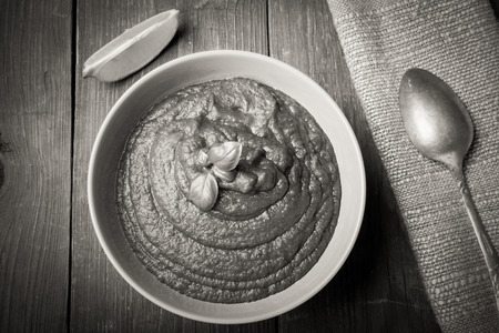 Turkish traditional meal - lentil soup Mercimek corbasi on a wooden table made of old boards. Toned.の写真素材