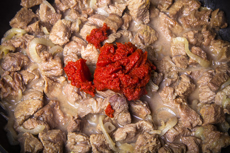 Stew meat on a pan. Ingredients for traditional turkish meal - Kuru fasulye. Toned.の写真素材