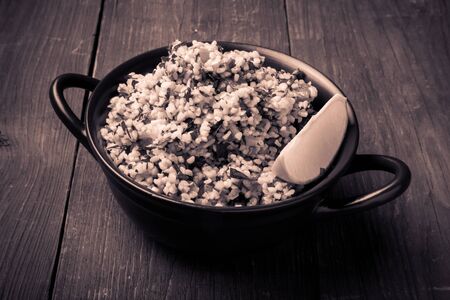 Turkish traditional meal - TaboulÃ© Salad on a wooden table made of old boards.の写真素材