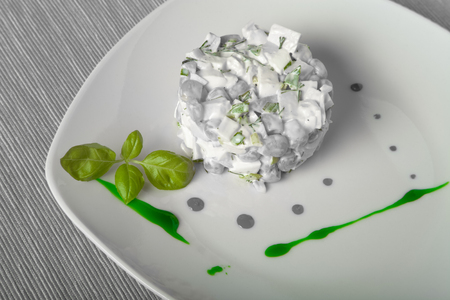 Salad serving by strokes of different sauces. Toned.の写真素材