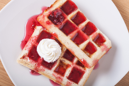 Traditional belgium soft fresh waffles with a decor on a plate.の写真素材