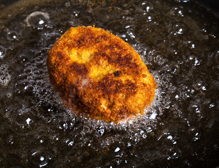 Cutlet fried in oil in a frying pan. Selective focus.の写真素材