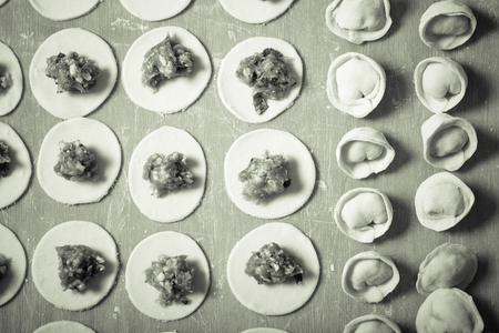 Pelmeni - Russian ravioli. Cooking process. Selective focus. Toned.の写真素材