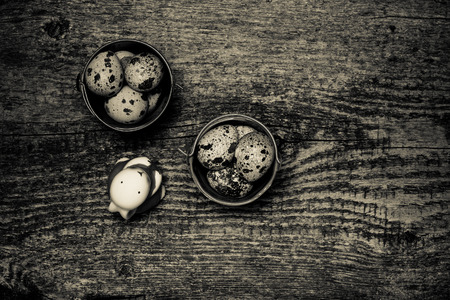 Composition with quail eggs. Wooden texture for background. Toned.の写真素材