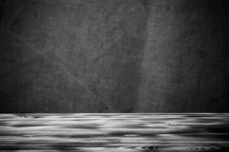 New wooden board and burlap background. Toned.の写真素材