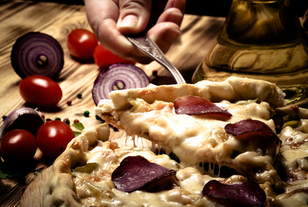 Prepared pizza with smelted cheese. Selective focus. Toned.の写真素材