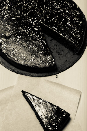Homemade chocolate cake on blue wooden background. Toned.の写真素材