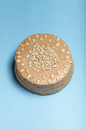 Homemade peanut cake on wooden background. Toned.の写真素材