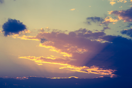 Clouds on the sky in sunset time. Toned.の写真素材