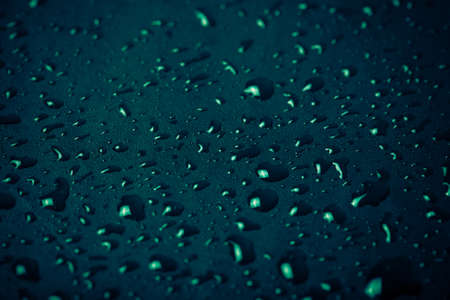Drops of water on a color background. Blue. Shallow depth of field. Selective focus. Toned.の写真素材