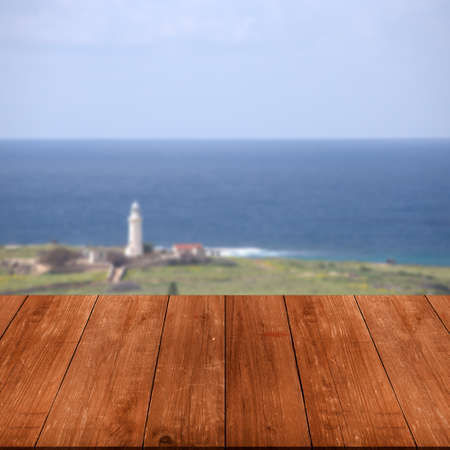Beautiful view of the Mediterranean Sea over old dark wooden table or board. Collage. Selective Focus.の写真素材