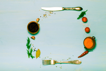 Herbs and spices on light blue wooden background. Toned.の写真素材