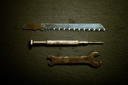 Old instruments on black background. Top view. Toned.