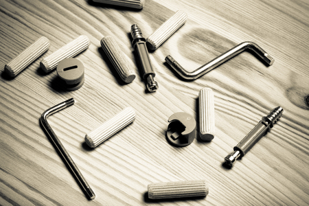 Set of furniture accessories on light wooden background. Top view. Toned.の写真素材