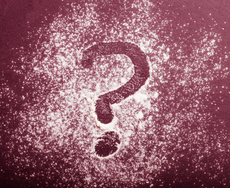 Flour spilling on color background of slate cutting board. Toned.の写真素材