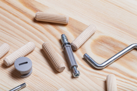 Set of furniture accessories on light wooden background. Top view.の写真素材