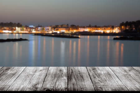 View of Cyprus town over old light wooden table or board. Collage. Selective Focus.の写真素材