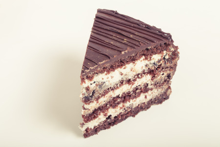 Chocolate homemade cake with gold decor. Toned.