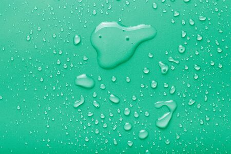 Dops of water on a color background. Green. Toned.の写真素材
