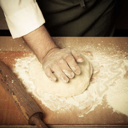 The process of making home bread by male hands. Toned.の写真素材