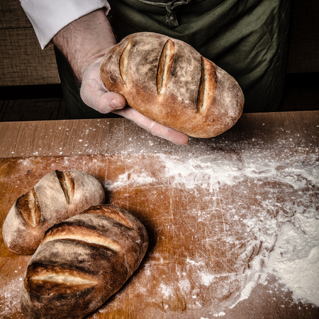 The process of making home bread by male hands. Toned.