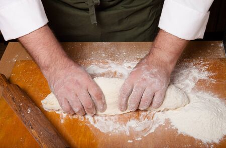 The process of making home bread by male hands.